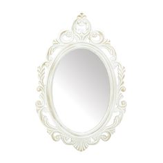 an ornate white mirror on a white wall