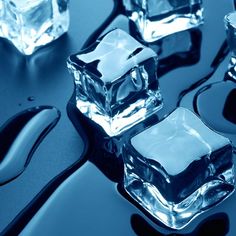 four ice cubes sitting on top of a table