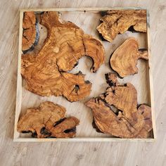 the wood is cut into pieces and placed in a wooden box on top of the floor