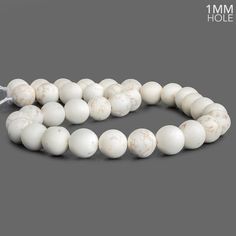 Beads measure 12mm with a 1mm large drill hole. Traditional Round Faceted Beads, Classic Round Large Beads, White Faceted Beads Round Jewelry, White Polished Oval Beads, White Faceted Round Beads, Round Beads, Beads