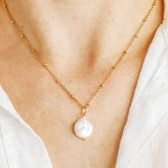 Add a unique touch of nature to your style with this beautiful Coin Pearl Charm Necklace! Featuring unique baroque pearls, hand-selected with care, this delicate layering necklace is the perfect accessory to show off your individual style. A wonderful gift idea for the special women in your life, this natural pearl necklace is sure to bring out her inner beauty! * Material: High Quality Stainless Steel * Finish: 18K Gold  * 12-15mm approx, bold irregular fresh water pearls They are natural baroque pearls, similar shape but each one unique  Each one hand-selected O T H E R * I N F O R M A T I O N * All items are nicely packaged ready to gift in elegant jewelry boxes. * If you can't find the information you need or need some advice for your design? Feel free to contact us. We are fast to rep Round Baroque Pearl Necklace Gift, Round Baroque Pearl Chain Necklaces, Baroque Pearl Chain Necklace For Gift, Delicate Baroque Pearl Necklace Gift, Delicate Baroque Pearl Necklace For Gifts, Baroque Pearl Chain Round Pendant Jewelry, Baroque Pearl Chain Jewelry With Round Pendant, Dainty Round Pearl Necklace For Jewelry Making, Round Baroque Pearl Pendant Necklace