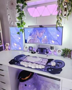 a computer desk with two monitors and a stuffed animal on the table next to it