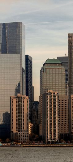 a large city with tall buildings on the water