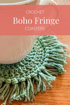 crochet boho fringe coaster on a wooden table with coffee cup in the background