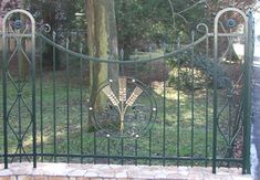 an iron gate with decorative designs on it