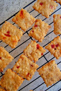 several squares of food sitting on top of a cooling rack