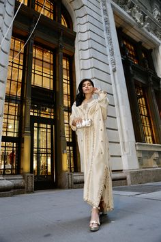 Ivory Rawsilk kaftan fully hand worked front & back with resham, zardozi, seesha & dabka Elegant Traditional Wear For Evening Eid, Elegant Traditional Wear For Eid Evening, Elegant Evening Traditional Wear For Eid, Silk Traditional Wear For Evening Eid, Long Sleeve Kurta For Evening And Eid, Elegant Raw Silk Gown With Dabka Detailing, Elegant Dabka Embellished Thobe With Traditional Drape, Wedding Kaftan With Mirror Work, Silk Long Sleeve Eid Gown