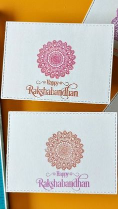 two business cards with the words happy radhbandhan written on them, sitting next to each other