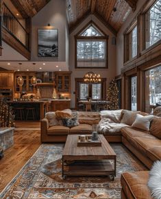 a living room filled with furniture and lots of windows