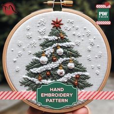 a hand embroidered christmas tree with ornaments on it and the words hand embroidery pattern in green