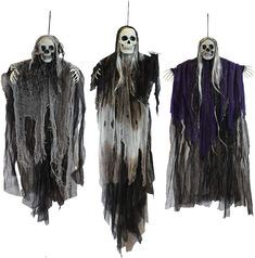 three halloween costumes hanging from clothes pins with long white hair and dark purple robes on them