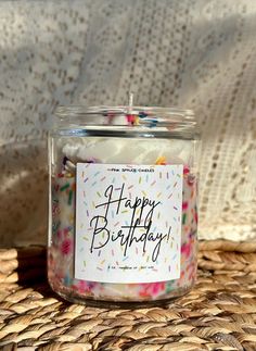 a birthday candle sitting on top of a wicker basket