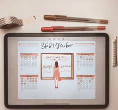 a tablet with an image of a woman's profile on the screen next to pencils and markers