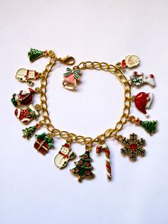 Christmas charm bracelet, 15 enameled and gold-plated charms, snowmen, trees, stockings and more, adjusts 7" to 8", 165 Christmas Charms, Etsy Jewelry, Charm Bracelets, Christmas Trees, Aurora, Jewelry Bracelets, Stockings, Charm Bracelet, Charms