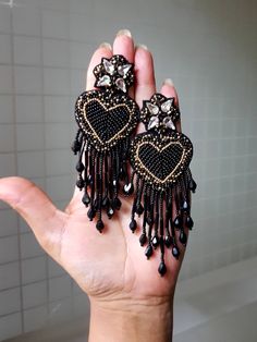 "Handmade black luxe heart fringes earrings. These statement handmade sparkling heart earrings are truly beautiful and ideal for parties and celebrations. Earrings measure about approx. 3.50\" long and 1.80\" wide. PS: Carnation jewelry is handmade & handcrafted in India hence there is a possibility of a slight or small imperfection due to the fact that these are made by hand. I still make sure that every piece made here is perfect to look at. For more details, please see our shop policies f Statement Beaded Earrings, Black Bead Embroidery, Black Heart Earrings, Black Statement Earrings, Beaded Heart, Long Earring, Handmade Fashion Jewelry, Botanical Wallpaper, Handmade Heart