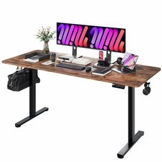 a computer desk with two monitors and a laptop on it's side, in front of a white background