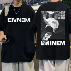 two young men wearing matching t - shirts that say emiem and emie on them