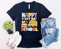 ABOUT OUR  Cute and funny Happy First Day of School shirt. Back to School. Teacher love their students and going back to school shirt. Welcome back.   👉 Unisex T-shirt - 100% Airlume combed and ringspun cotton  - Soft cotton and quality print make users fall in love with it over and over again.  - These t-shirts have-ribbed knit collars to bolster shaping. - Printed and shipped from the USA CARE INSTRUCTIONS - Wash inside out with like colors. - Tumble dry or hang to dry. - Try not to iron dire Fun T-shirt With Funny Print For Back To School, Back To School Funny Print T-shirt, Funny Print T-shirt For Back To School, Fun Back To School T-shirt, Fun Slogan Tops For School, Blue Fun T-shirt For Back To School, Trendy T-shirt For End Of School Year Events, Fun T-shirt For College End Of School Year, Fun School Tops With Funny Text