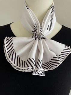 This 100% silk twill luxury square scarf with hand-rolled edges has a minimalist black and white stripes design. Could go well with any outfit.  Material: 100 % mulberry silk twill This scarf is made of 14 momme 100% mulberry silk which is heavier, softer, and more durable. Silk twill is one of the finest silk fabrics, woven with a pattern of diagonal parallel ribs for reinforced structure. Perfect gift for Valentine's Day, Mother's Day, Birthday, and Anniversary gifts. Size: 70 cm x 70 cm / 27 in x 27 in As this scarf is hand-rolled, the dimensions indicated may vary. Edges: Hand-Rolled  This essential accessory complements any outfit. Can style as a neck scarf, a head scarf, or at the waist. Suitable for all seasons, gift ideas for the holiday season, and special occasions. Care Instruct Scarf Square, Minimalist Black And White, Silk Bandana, Silk Twill Scarf, Silk Fabrics, Luxury Scarves, Hair Scarf, Head Hair, Stripe Silk