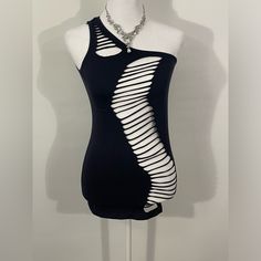 a mannequin wearing a black dress with white lines on the front and back