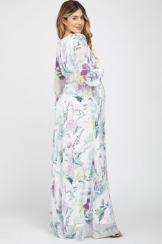 A stylish maternity dress perfect for cocktail parties and special occasions.  A floral, chiffon maternity maxi dress featuring long, cuffed sleeves with buttons, a cinched elastic waist, pleated details, a waist tie, and a v-neckline. Double lined to prevent sheerness. The White Floral Chiffon Long Sleeve Pleated Maternity Maxi Dress is perfectly bump-friendly! Flowy Modest Maternity Maxi Dress, Modest Maternity Maxi Dress For Spring, Spring Long Sleeve Flowy Maternity Dress, Flowy Long Sleeve Maternity Dress For Spring, Flowy Long Sleeve Maternity Maxi Dress, Flowy Long Sleeve Maxi Dress For Maternity, Spring Floral Print Maternity Maxi Dress, Spring Maternity Maxi Dress With Floral Print, Flowy Floral Print Maternity Dress