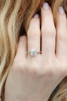 a close up of a person wearing a ring