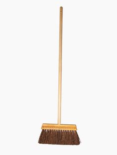 a broom with a wooden handle on a white background