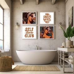 a bathroom with three pictures on the wall and a bathtub in the foreground