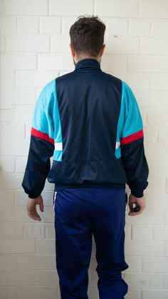 Vintage Tracksuit | Vintage Track Top | Old School Tracksuit | Multicolor Tracksuit Jacket Vintage sport tracksuit, for both genders. Apparel in great condition, freshly washed and ready to be worn. It may have sings of passing time, thing that make it more authentic and with personality. Multi color makes tracksuit unique, festive. Tracksuit has one waist pocket. Size Medium Good used condition: 10/10 Track jacket: Shoulders: 60cm //23,622inches Sleeve length:60cm //23,622inches Total Length:69 Retro Color Block Track Jacket For Sports, Multicolor Sportswear Track Jacket For Sports, Multicolor Sports Track Jacket, Blue Cotton Track Jacket For Sports, Sportswear Track Jacket With Contrast Panels, Blue Sportswear Track Jacket For Gym, Blue Sportswear Tracksuit For Training, Sporty Multicolor Track Jacket For Streetwear, Sporty Track Jacket With Contrast Panels For Sports