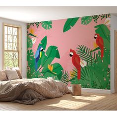 a bedroom with pink wallpaper and colorful parrots on it