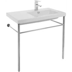 a white sink sitting on top of a metal stand