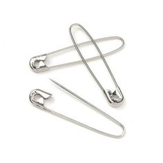 three pairs of metal hair clips on a white background