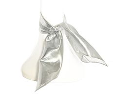 This silver lurex scarf boasts a vintage charm that will elevate any outfit. With shimmering details and a timeless design, it adds a touch of sophistication and glamour to your look. Made with high-quality materials, it's truly a must-have accessory for any fashion enthusiast. Size: 19" by 19" square with the widest length diagonal 31" When in doubt it's best to measure your neck circumference for the best fit.  Silver lame Neck Scarf / Headwrap dot 19" square neck scarf. Can also be worn in th Gold Scarf, Lame Fabric, Cooling Scarf, Gold Lame, Synthetic Fiber, Neck Scarves, Head Scarf, Square Neck, Head Wraps