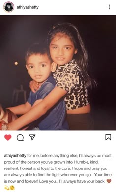 two children hugging each other in front of an instagram