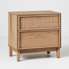 a wooden cabinet with two drawers on one side and an open drawer on the other