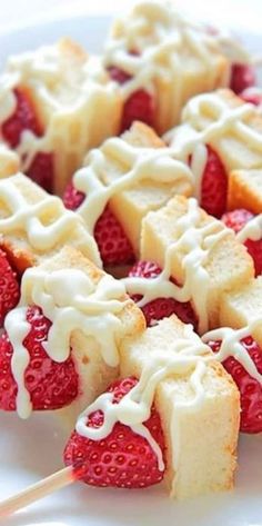 strawberry shortcakes with icing on a white plate