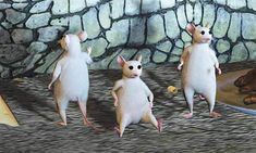 three mice are standing in front of a stone wall