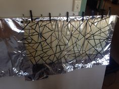 a piece of tin foil that has been wrapped in black and white lines on it