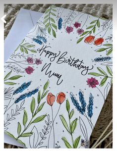 a happy birthday card with flowers on it