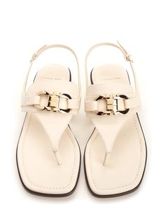 'Lula' thong sandal by Ferragamo, in white leather with double Gancini detail and flat sole. Composition: upper: 100% calf lining: 100% lamb sole: 100% bos taurus. Chic White Calf Leather Sandals, White Flat Heel T-strap Sandals With Buckle Closure, White Calf Leather Sandals With Buckle Closure, White Flat Slingback Sandals With Buckle Closure, Classic White Sandals With Leather Sole, White Classic Sandals With Single Toe Strap, Classic White Sandals With Single Toe Strap, Elegant Toe Post Slingback Sandals, Elegant White Calf Leather Sandals