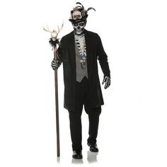 a man dressed up as a skeleton holding a stick and wearing a mask with horns