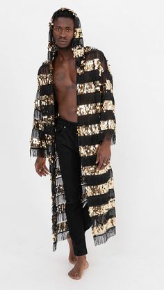 You will love this mens fringed sequin hooded kimono! FULLY SEQUINED FABRIC : Shine brighter than ever before and turn heads with bold, sparkly designs with a pair of Studio 54 Fashion Mens Sequined Hooded Fringe Kimono Jacket and shine a light on how good you look! The fabric is completely handcrafted with two types of sequins.  FLATTERING RELAX CUT : These sequin festival duster feature a strong silhouette and has a very cool hood! The lining is sewn on the inner part of the joints and it neve Long Sleeve Outerwear For Party And Festival, Disco Style Winter Festival Outerwear, Winter Festival Disco Outerwear, Sequin Outerwear For Party And Festival, Gold Cardigan For Winter Party, Sequin Outerwear For Party Season And Festivals, Long Sleeve Sequined Outerwear For Festivals, Winter Festival Sequined Outerwear, Gold Cardigan For Spring Party