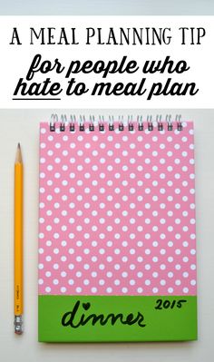 a pink and green notebook with the words dinner written on it next to a pencil