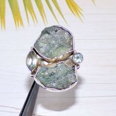 This is a high quality handmade Solid 925 Sterling Silver Jewelry. The piece is ready to ship and you will get the exact same piece as shown in photo. Faceted Blue Topaz Rings, Rough Aquamarine Rings, Raw Aquamrine, Solid 925 Silver Ring, For Her, Designer Rings, Boho Ring, Size 7US, D103 Stone name:  Aquamarine, Blue Topaz Weight:  10.5Grams Ring Size: US 7 Stone SIze- 4x8mm, 4mm, 11x 12 mm Metal: Sterling Silver Purity of Silver: 92.5% Each jewelry piece is nicely packed and sent into post. Wo Unique Handmade Aquamarine Rings, Silver Aquamarine Multi-stone Rings, Silver Multi-stone Aquamarine Rings, Blue Topaz Rings, Topaz Rings, Rings Boho, Designer Rings, Natural Gemstone Jewelry, Aquamarine Rings