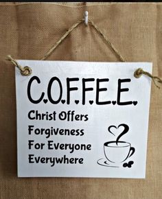 a sign hanging on the wall that says coffee christ offers forgingness for everyone everywhere