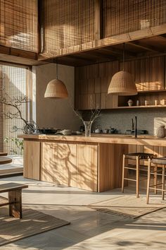 an open kitchen and dining area with bamboo shades