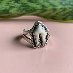 This ring is handmade, made to order using 100 percent sterling silver. It will ship within three weeks of order date. Each ring will vary slightly, due to the fact that real teeth are natural items and no two are alike. The ring pictured is very close to what the final product will be. Each ring will feature the small front side molar from a coyote. Please choose your own custom ring size! Since each ring is made to order for your exact size, we do not accept returns. Questions or comments? Ple Heirloom Sterling Silver Hand Cast Jewelry, Hand Cast White Sterling Silver Jewelry, Heirloom Hand Cast Sterling Silver Jewelry, Heirloom Style White Sterling Silver Engraved Ring, Heirloom White Engraved Sterling Silver Ring, Heirloom Style Engraved White Sterling Silver Ring, Artisan White Sterling Silver Ring, Unique Untreated Open Ring, Tooth Ring