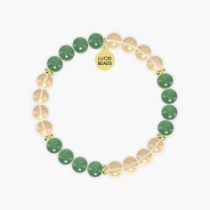 This bracelet named Success Manifestation combines the vibrant energy of Citrine with the soothing properties of Aventurine. Citrine, known as the 'merchant's stone', is associated with success, prosperity, and abundance. Its sunny yellow color promotes positivity and motivation, helping to manifest goals and dreams. Aventurine, with its calming green hues, is believed to attract luck and opportunities while enhancing creativity and confidence. Together, these gemstones create a harmonious blend Yellow Spiritual Gemstone Bracelets, Yellow Spiritual Bracelet With Gemstone, Yellow Spiritual Gemstone Bracelet, Gold Agate Crystal Bracelet For Healing, Spiritual Citrine Bracelets For Healing, Spiritual Healing Citrine Bracelet, Everyday Spiritual Aventurine Bracelets, Gold Jade Bracelets With Natural Stones, Spiritual Citrine Beaded Bracelets For Healing