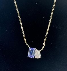 Gorgeous Toi Et Moi Genuine Tanzanite & Lab Grown Diamond Set in 14kt Yellow Gold  It hangs on a 14 Kt Yellow Gold Chain which  is Adjustable from 16-18 Inch    1 6x4mm Lab Grown Diamond .35 Carat total Weight F-G VS 1-6x4 Octagon Genuine Tanzanite  .50 Carat Vs Quality This is one of the first in this collection Check back for more soon as well as our Genuine Spinel Collection  This Necklace Is Must Add To Your Jewelry Collection. It Means You And Me And Symbolizes Love And Partnerships. It Fea Yellow Gold Tanzanite Necklace For Anniversary, Fine Jewelry Tanzanite Necklace, Gold Tanzanite Necklace For Anniversary, Tanzanite Necklace, Yellow Gold Chain, Diamond Set, 14kt Gold, Lab Diamonds, Lab Grown