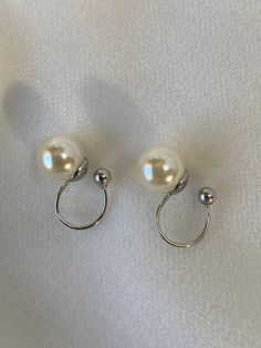 Very pretty, classic, pearl stud ivory Pearl earrings with a clip on feature if you do not have pieced ears.  The ivory pearls are approx 8mm in diameter  I only have one pair of these earrings Other earrings are available.  Please read my POLICIES SECTION for shipping information. Www.etsy.com/shop/heathertaylorstudio/policy Please visit my home page to see all the other designs and vintage jewellery that I have available. Www.etsy.com/shop/heathertaylorstudio I am in the U.K but ship worldwide Classic Pearl Drop Clip-on Earrings, Round Clip-on Pearl Earrings, White Pearl Clip-on Earrings, Silver Clip-on Pearl Earrings, Pearl White Pearl Drop Clip-on Earrings, Cream Pearl Earrings For Formal Occasions, Pearl Hair Comb Wedding, Pearl Comb, Bridesmaid Hair Comb